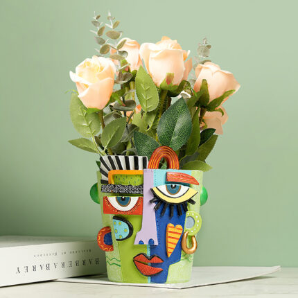 Colorful Abstract Face Planter with Geometric Patterns - Green Resin Flower Pot for Roses and Succulents. Modern Art Decor with Blue, Orange, Purple Stripes, Polka Dots, and Bold Lips Design.