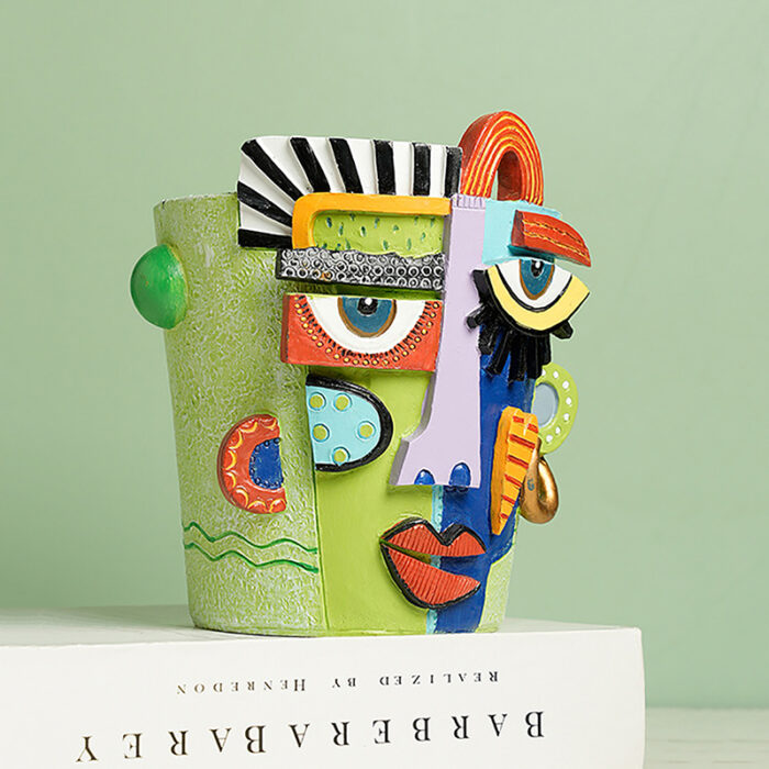 Artistic Face Planter with Gold Hoop Earrings & Colorful Patterns - Hand-Painted Resin Flower Pot for Succulents. Pop Art Indoor Decor Featuring Blue Eyes, Red Lips, Heart Motifs & DOECON/AREY Text.
