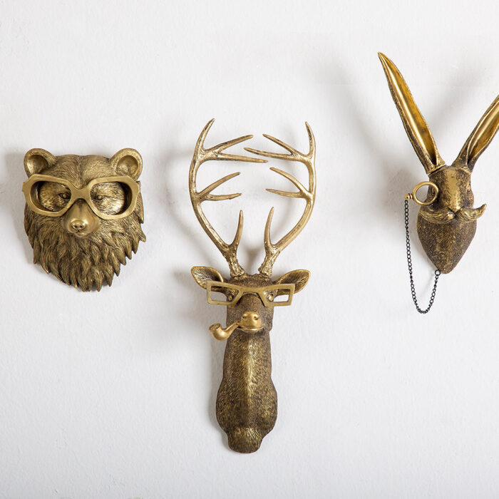 Gold animal head wall decor set (bear/deer/rabbit) with glasses, pipe & chain details on pure white wall | Whimsical faux taxidermy trio for modern interiors