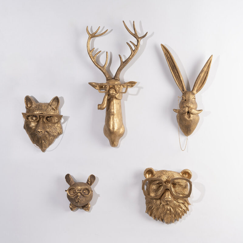 Gold resin animal head wall decor set (fox/deer/rabbit/bear) with retro glasses, symmetrically arranged on pure white background | Modern minimalist faux taxidermy wall sculptures